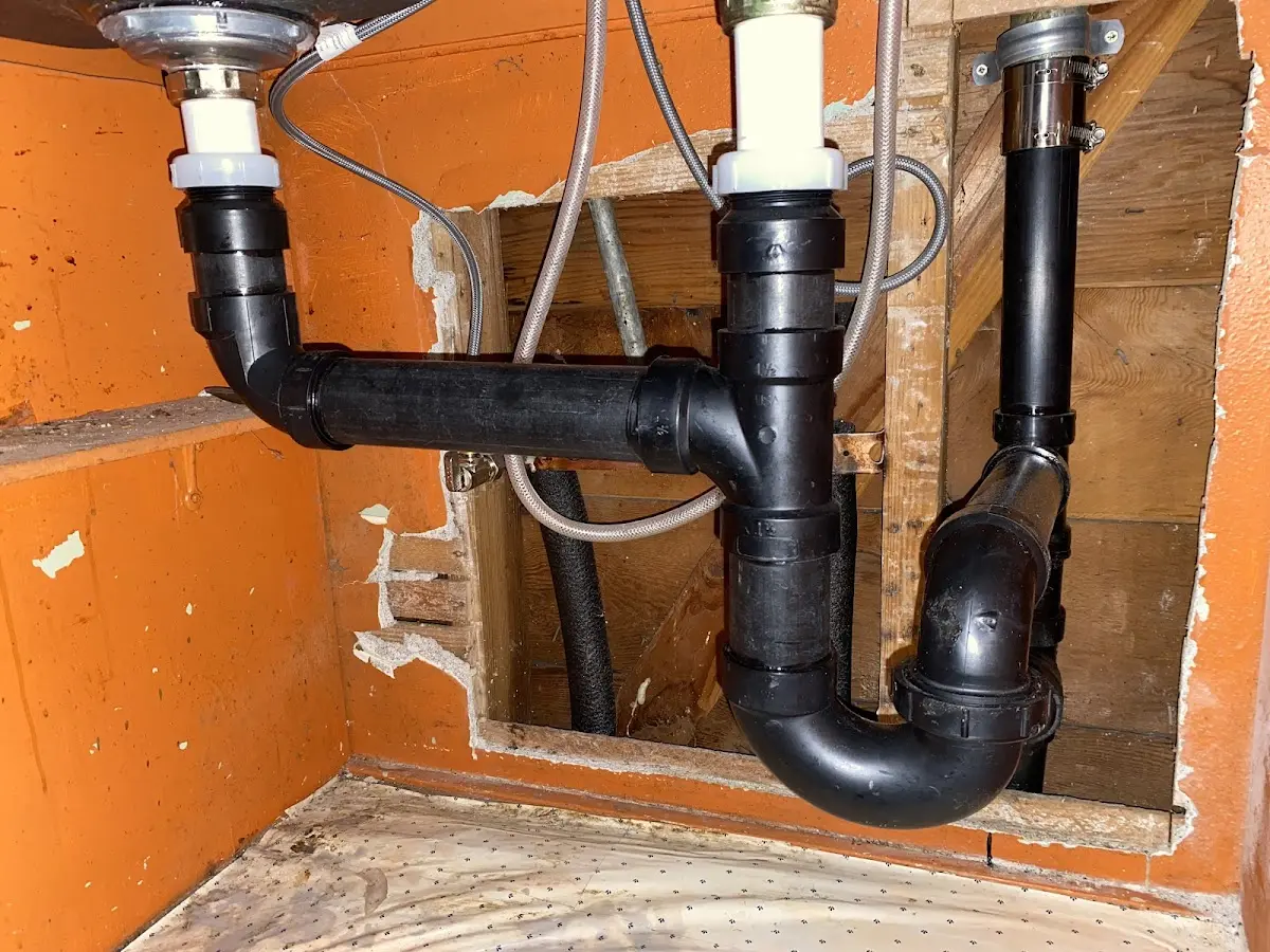 Professional Garbage Disposal Repair equipment and tools on the job in Wilton